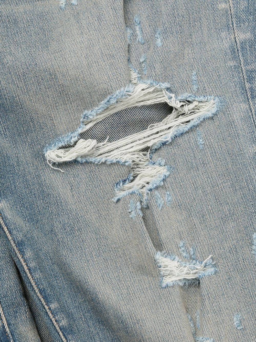 AMIRI DISTRESSED SKINNY JEANS