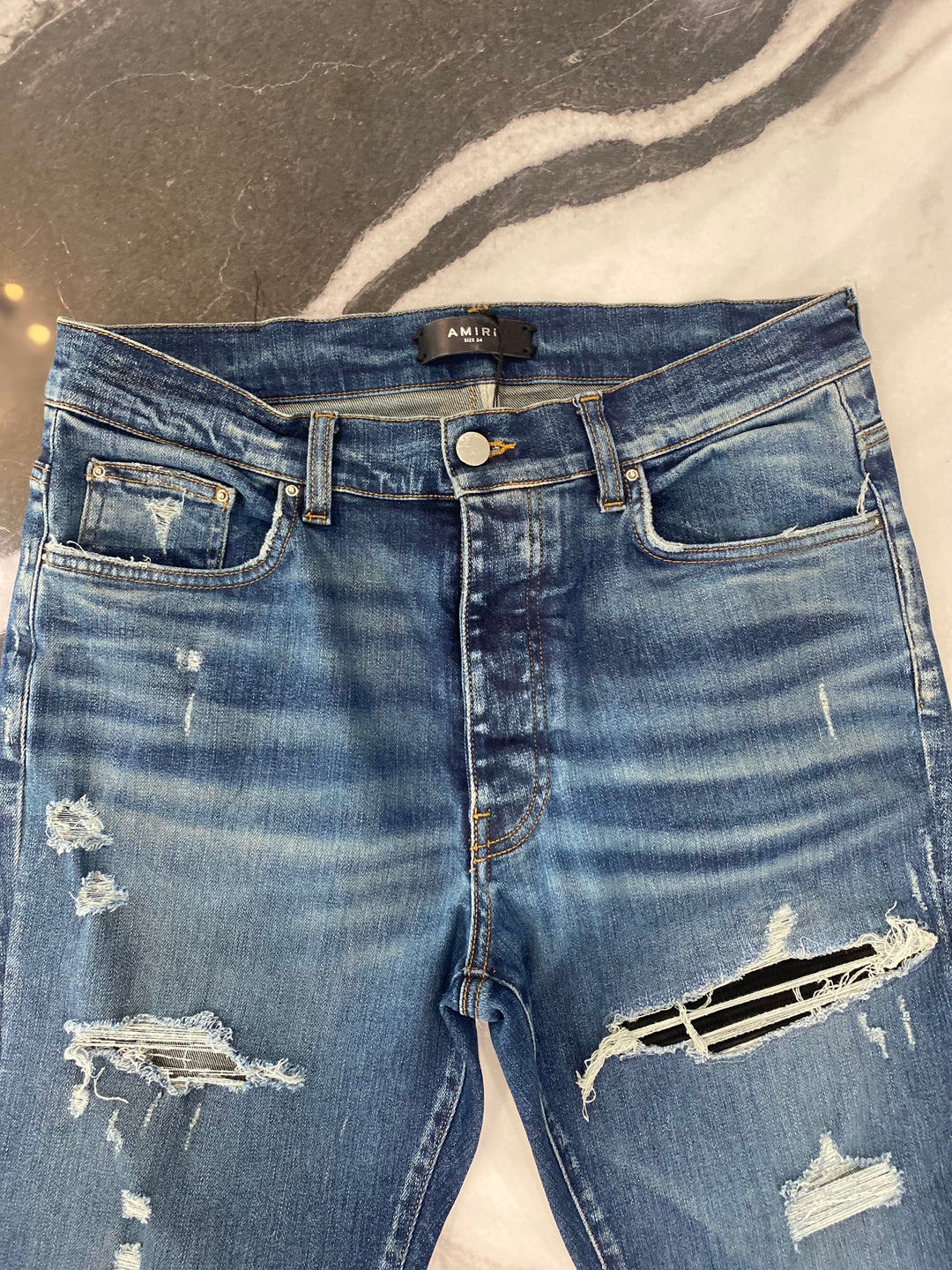 AMIRI MX1 DISTRESSED SKINNY LEG JEANS