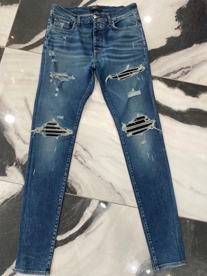 AMIRI MX1 DISTRESSED SKINNY LEG JEANS