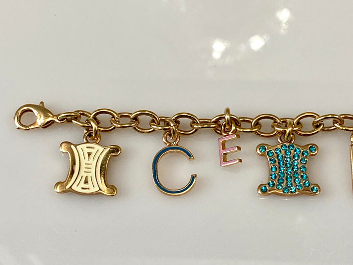 Bracelet／color：Gold／initial『 E 』CELINE CÉLINE CHARM BRACELET – Caroline's Fashion Luxuries