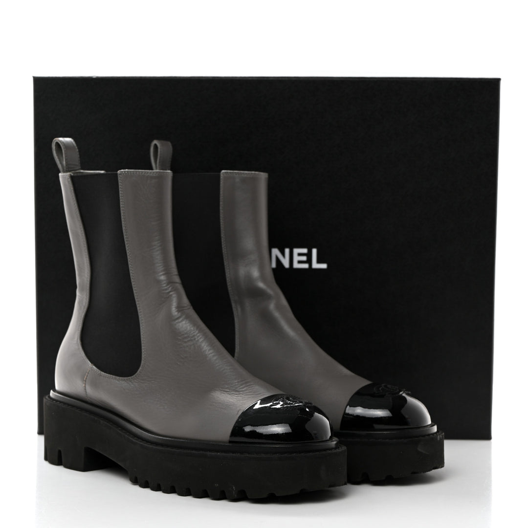 CHANEL CC CRUMPLED CALFSKIN PATENT CAP TOE CHELSEA BOOTS
