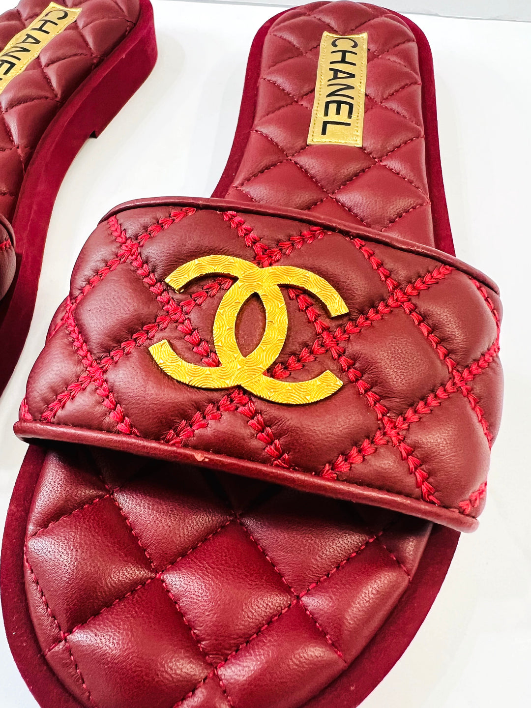 CHANEL INTERLOCKING CC LOGO QUILTED LAMBSKIN MULES