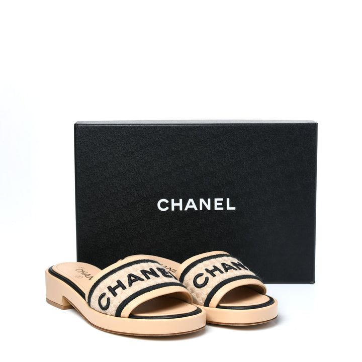 CHANEL LAMBSKIN EMBROIDERED LOGO MULES