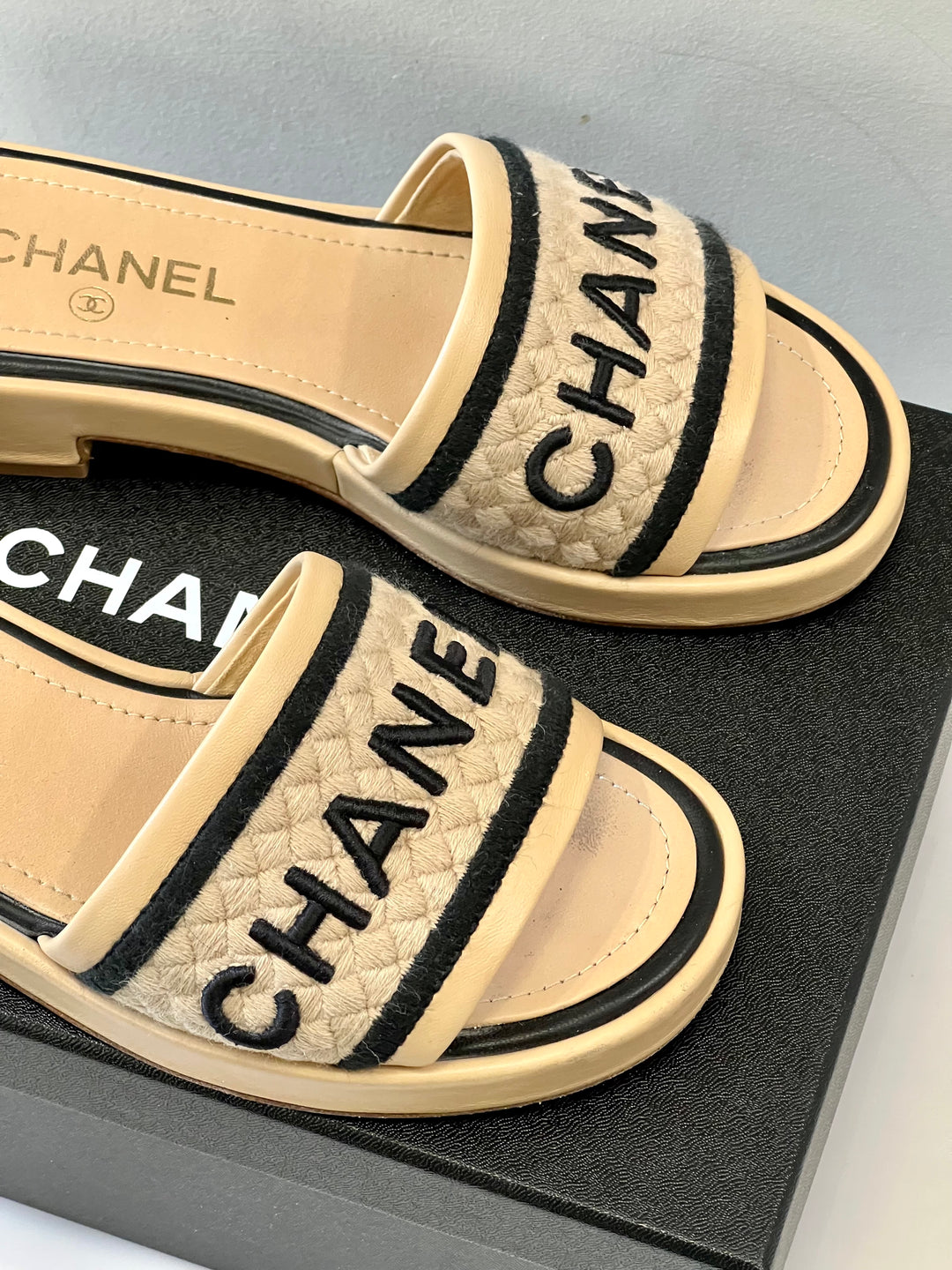 CHANEL LAMBSKIN EMBROIDERED LOGO MULES