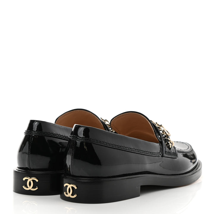 CHANEL SHINY PATENT CALFSKIN LOGO LOAFERS