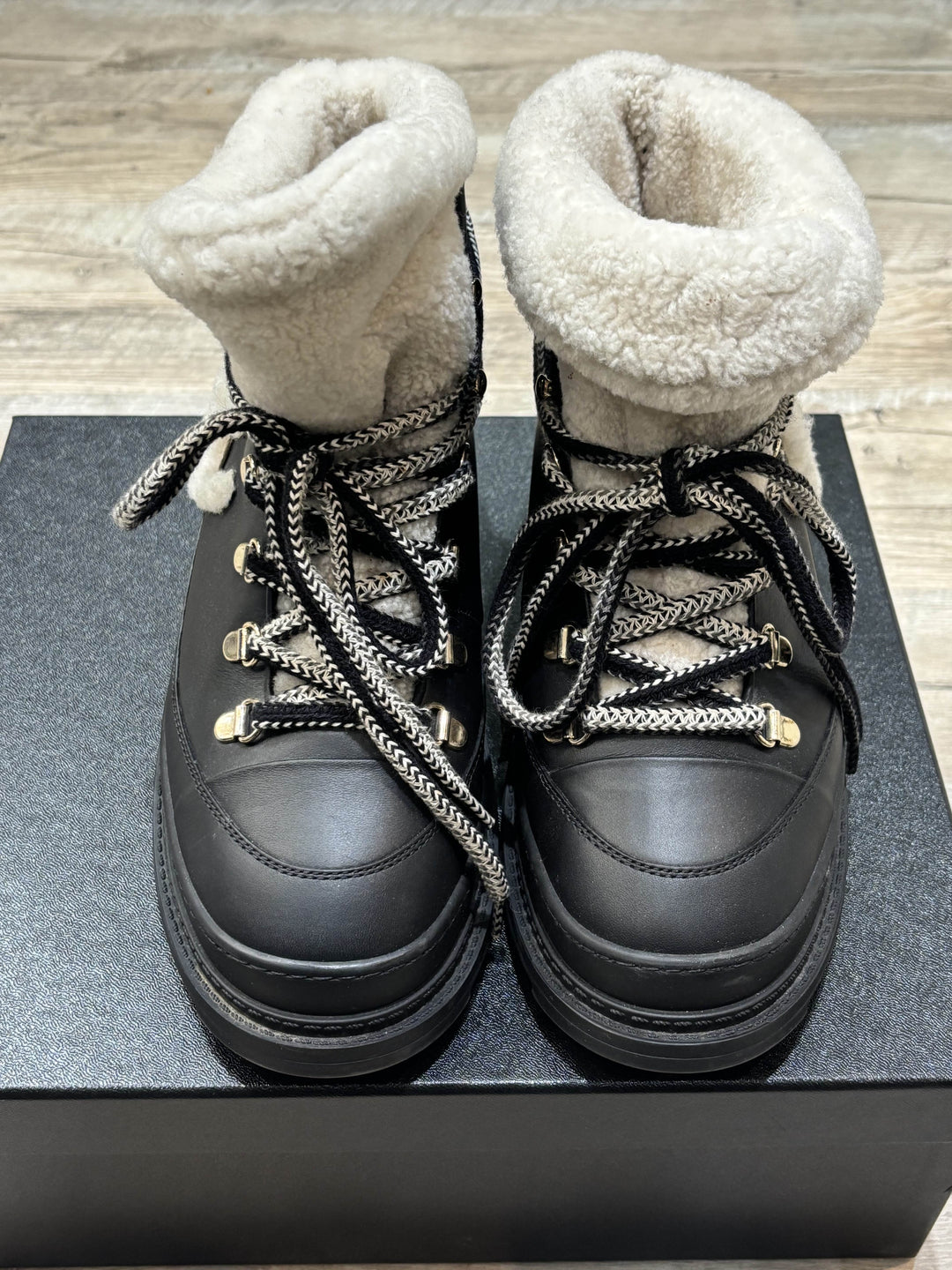 CHANEL CC CALFSKIN LEATHER SHEARLING LACE-UP BOOTS