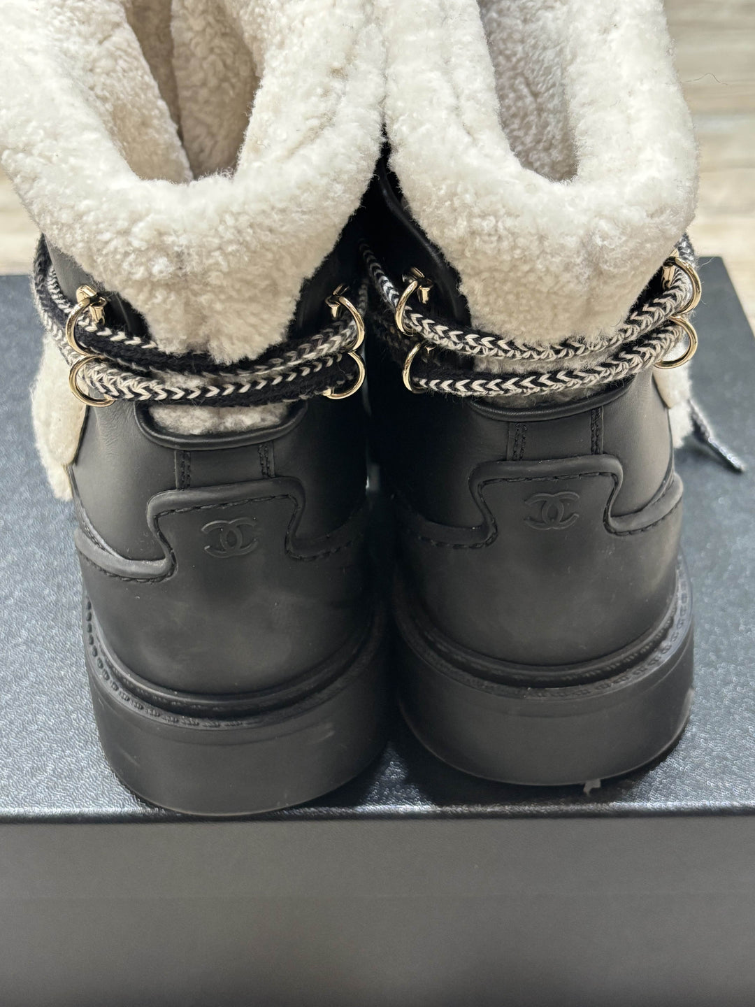 CHANEL CC CALFSKIN LEATHER SHEARLING LACE-UP BOOTS