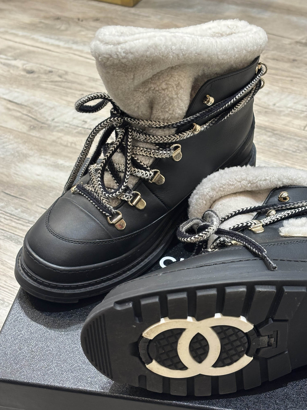CHANEL CC CALFSKIN LEATHER SHEARLING LACE-UP BOOTS