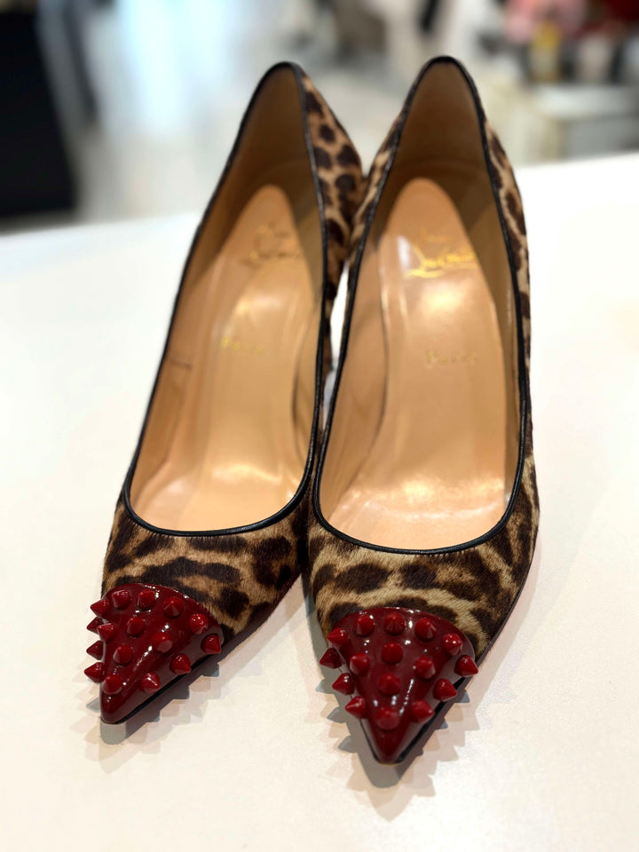 LOUBOUTIN PONY HAIR LEOPARD GEO SPIKE STUDDED TOE PUMPS