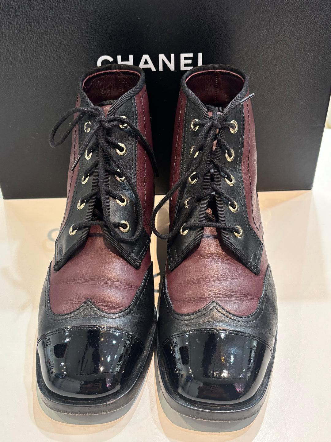 CHANEL CC LOGO CAP TOE CALFSKIN &amp; PATENT LEATHER LACE-UP ANKLE BOOTS