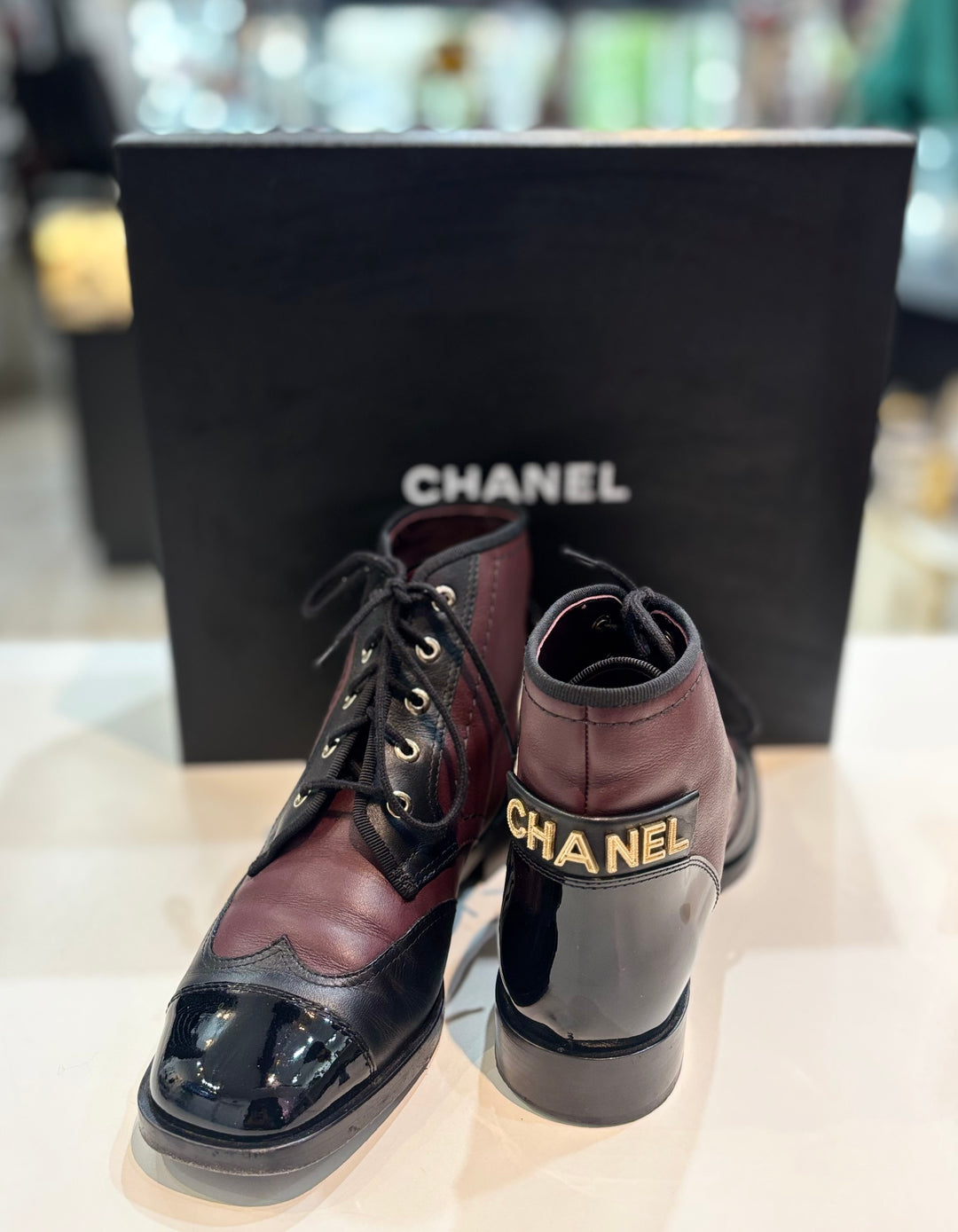 CHANEL CC LOGO CAP TOE CALFSKIN &amp; PATENT LEATHER LACE-UP ANKLE BOOTS