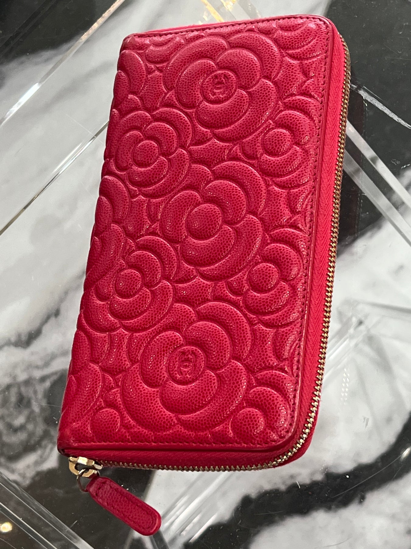 Chanel Zippy Embossed Leather Camellia Wallet