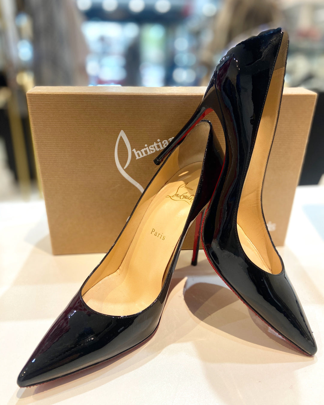 CHRISTIAN LOUBOUTIN DECOLLETE 100 PATENT LEATHER PUMPS