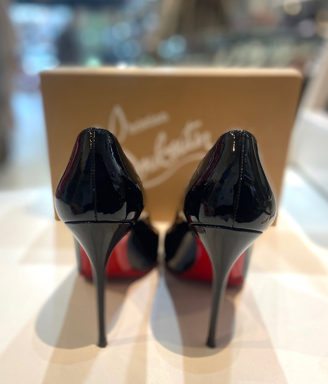 CHRISTIAN LOUBOUTIN DECOLLETE 100 PATENT LEATHER PUMPS