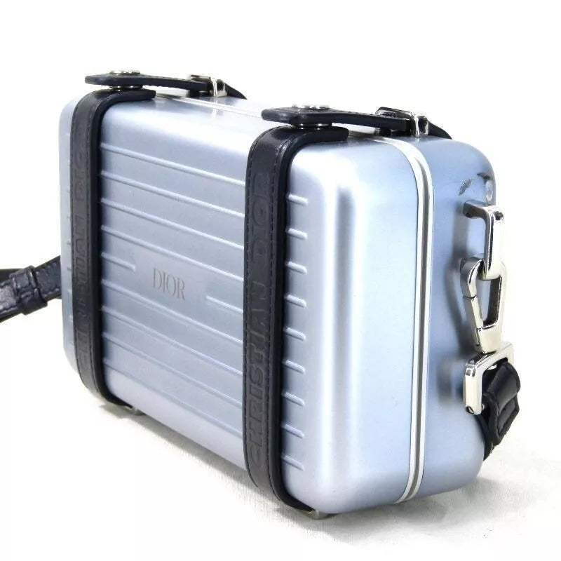 DIOR X RIMOWA ALUMINUM PERSONAL CLUTCH ON STRAP – Caroline's