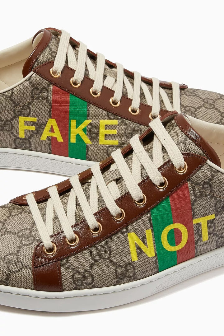 GUCCI ACE GG MONOGRAM FAKE/NOT CANVAS &amp; LEATHER SNEAKERS