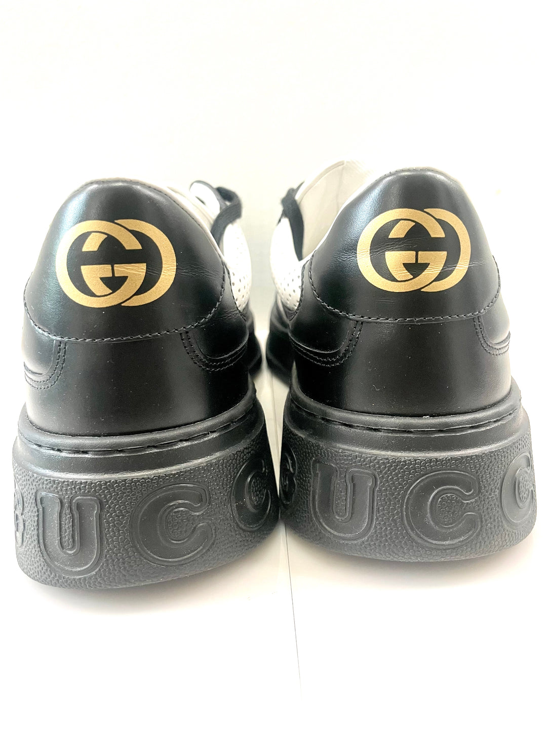 GUCCI GG EMBOSSED LOW-TOP LEATHER SNEAKERS