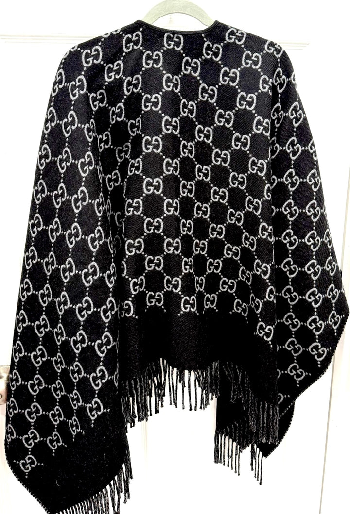 GUCCI GG MONOGRAM WOOL JACQUARD FRINGED CAPE IN BLACK