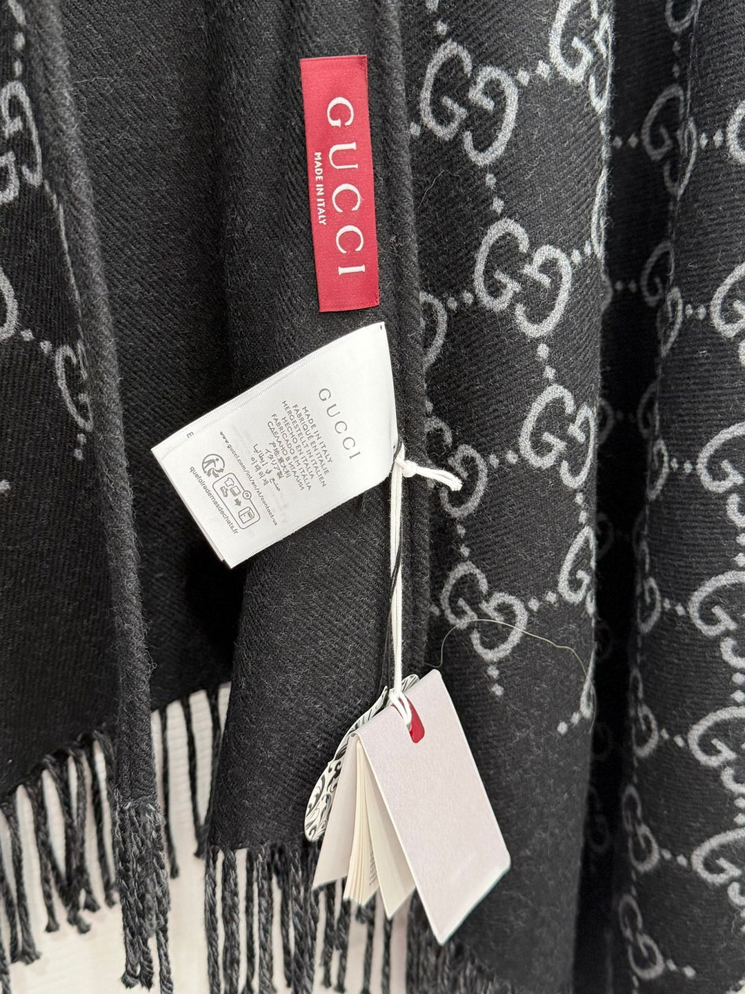 GUCCI GG MONOGRAM WOOL JACQUARD FRINGED CAPE IN BLACK