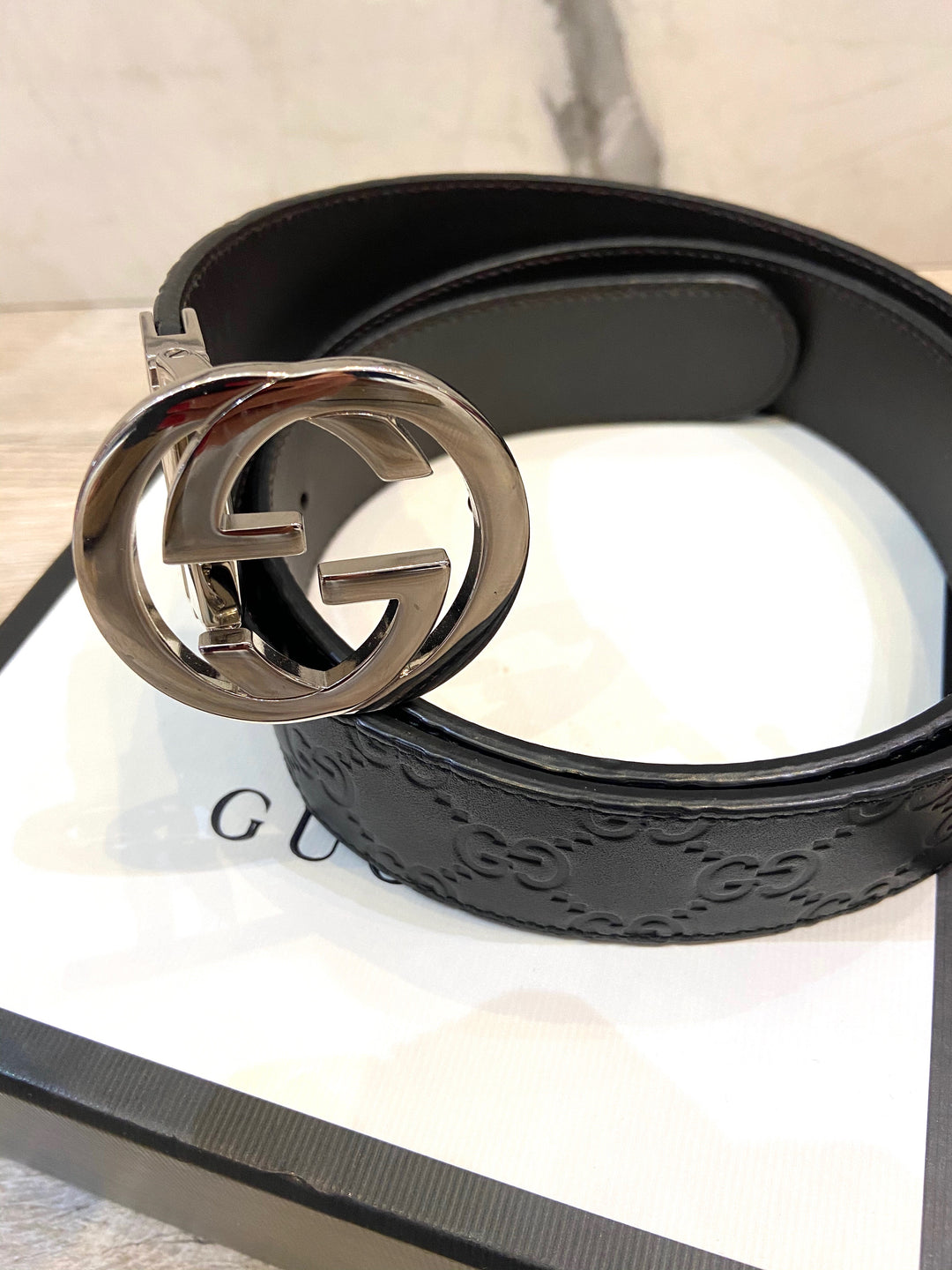 GUCCI INTERLOCKING G EMBOSSED LEATHER BELT