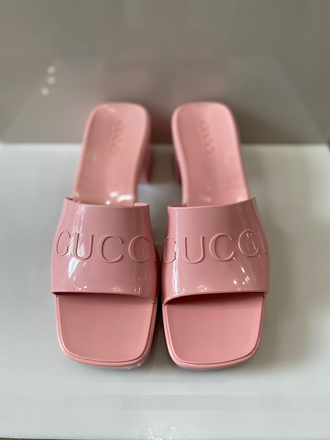 GUCCI PINK 60 EMBOSSED LOGO SLIDE SANDALS