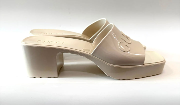 GUCCI EMBOSSED LOGO PLATFORM RUBBER MULES