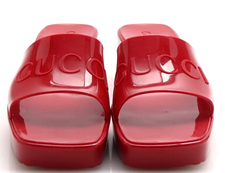 GUCCI EMBOSSED LOGO RUBBER PLATFORM MULES
