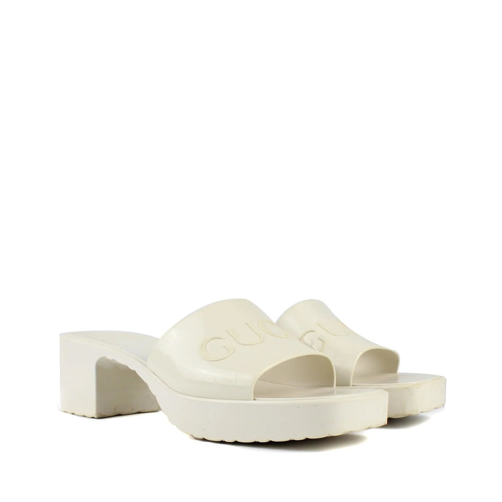 GUCCI EMBOSSED LOGO PLATFORM RUBBER MULES
