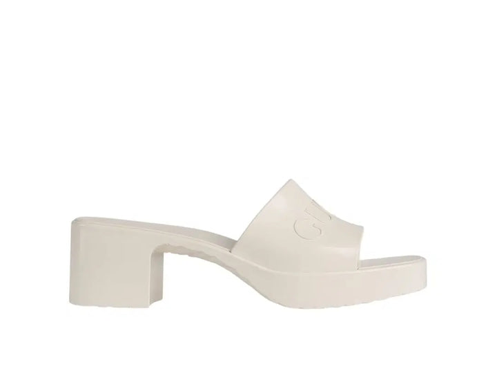 GUCCI EMBOSSED LOGO PLATFORM RUBBER MULES