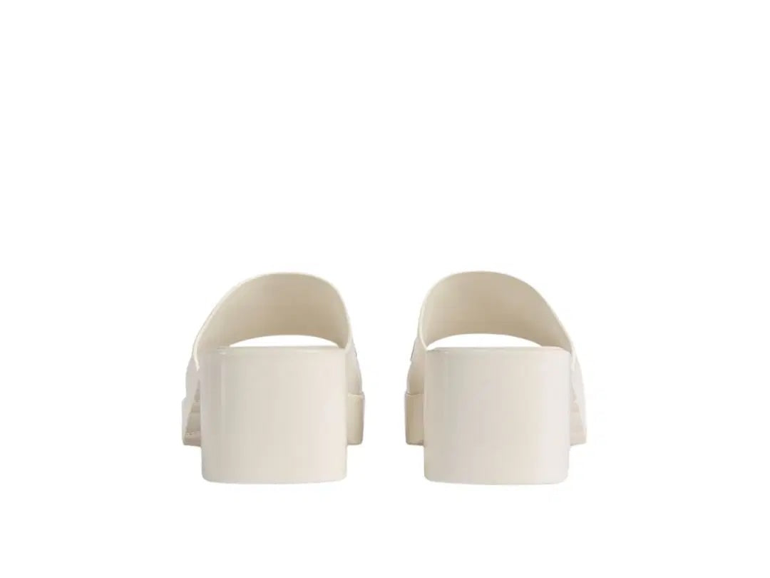 GUCCI EMBOSSED LOGO PLATFORM RUBBER MULES