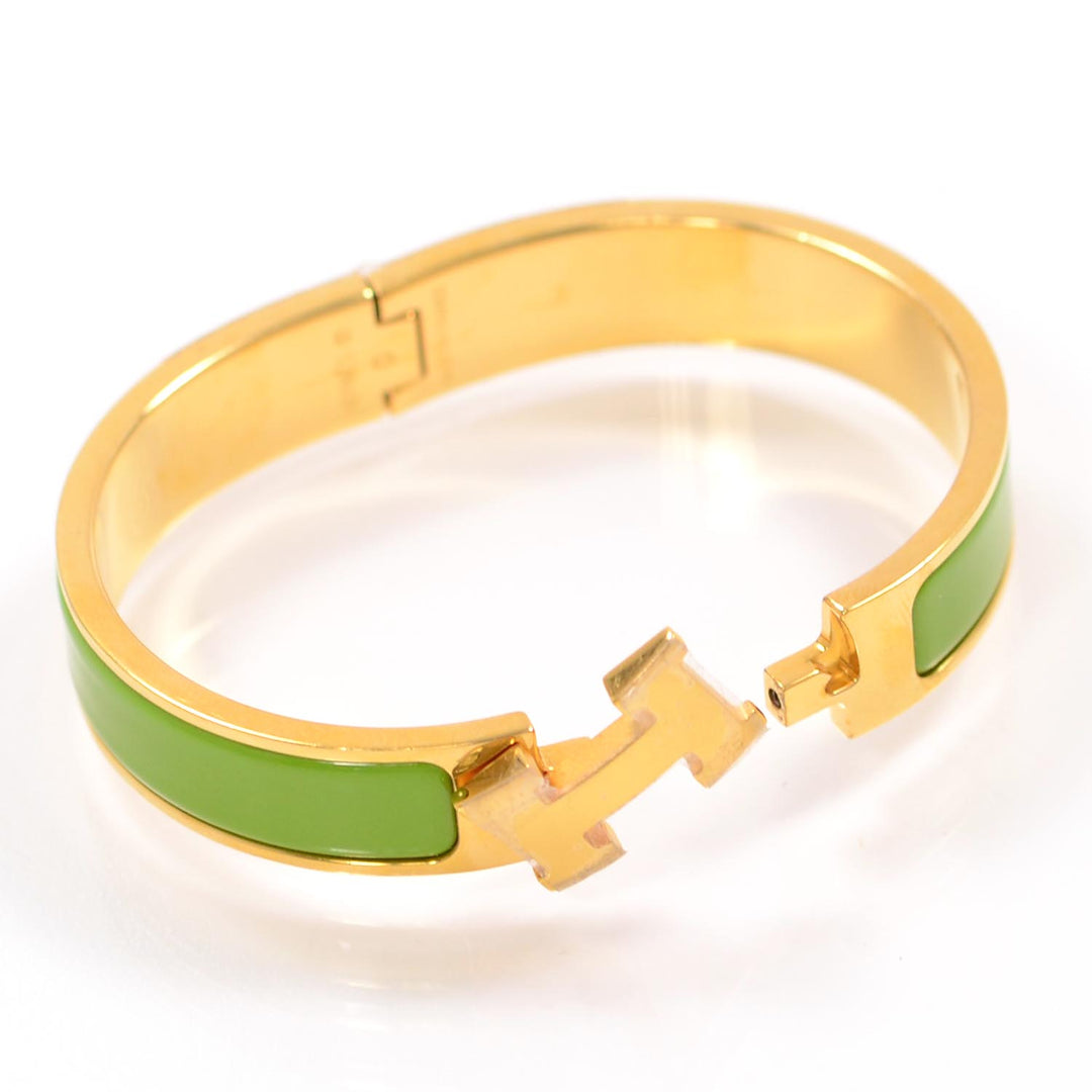 HERMÈS ENAMEL NARROW CLIC CLAC H BRACELET IN GREEN