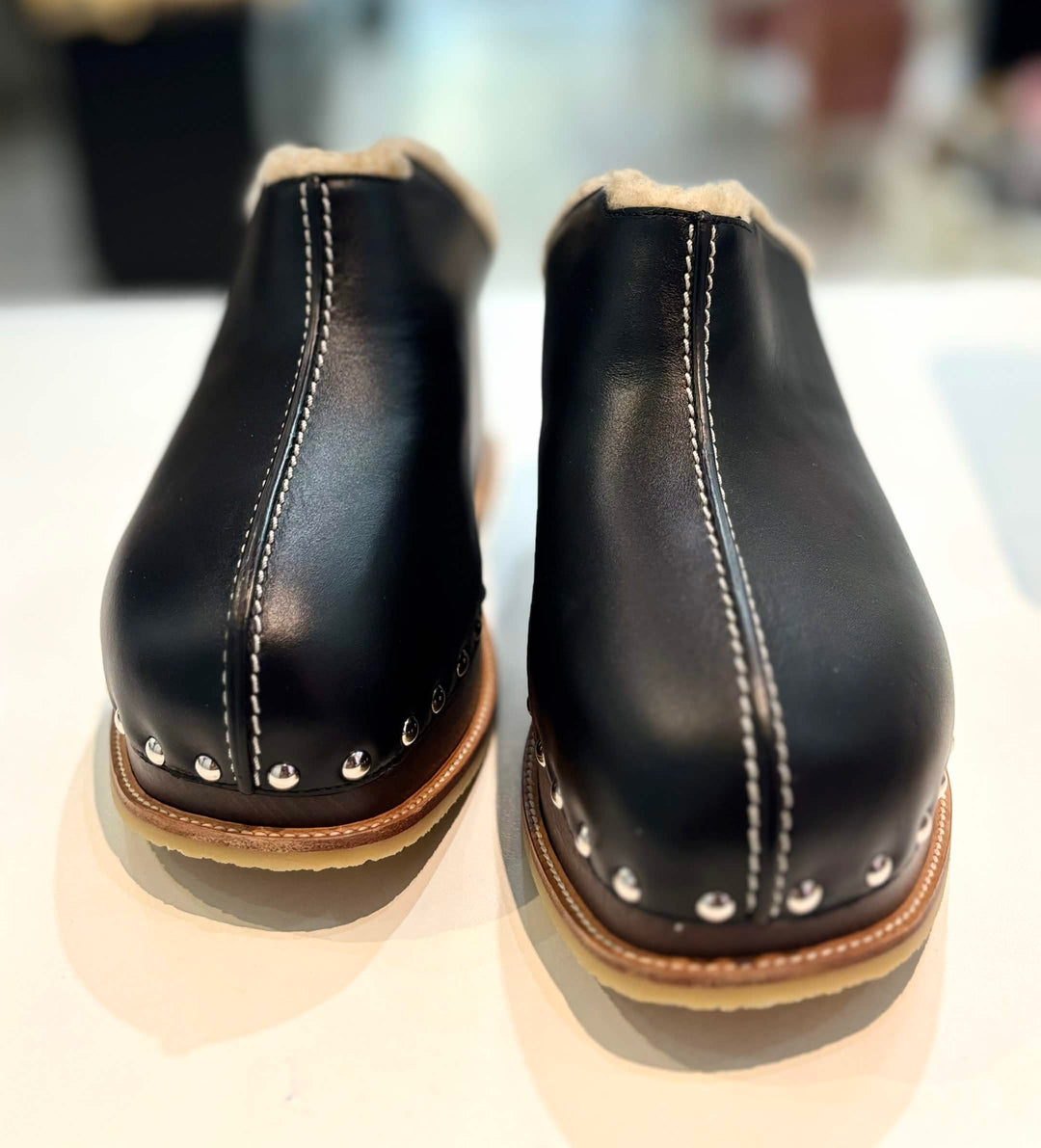 HERMÈS EARTH STUDDED SHEARLING WEDGE HEEL MULES