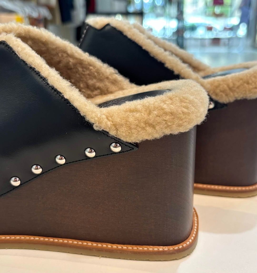 HERMÈS EARTH STUDDED SHEARLING WEDGE HEEL MULES