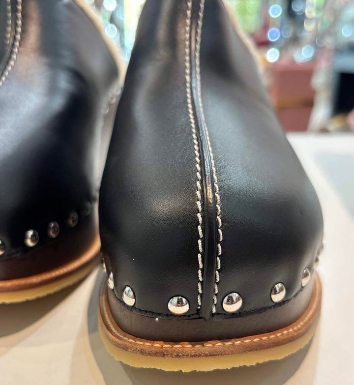 HERMÈS EARTH STUDDED SHEARLING WEDGE HEEL MULES