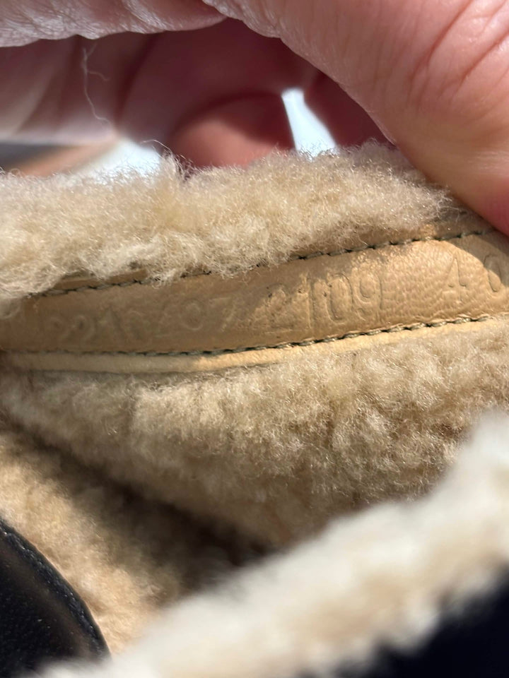 HERMÈS EARTH STUDDED SHEARLING WEDGE HEEL MULES