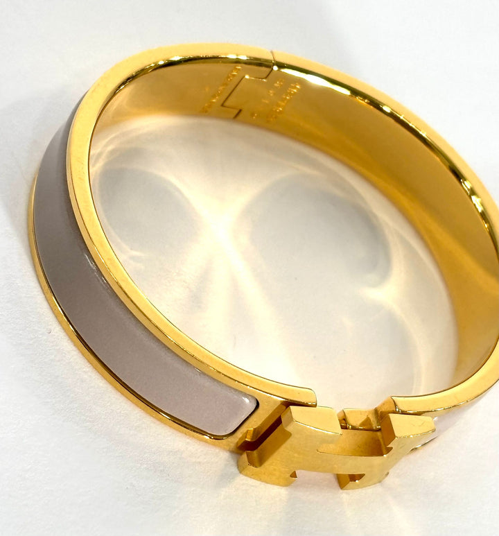 HERMÈS MARRON GLACE ENAMEL AND GOLD METAL CLIC H BRACELET