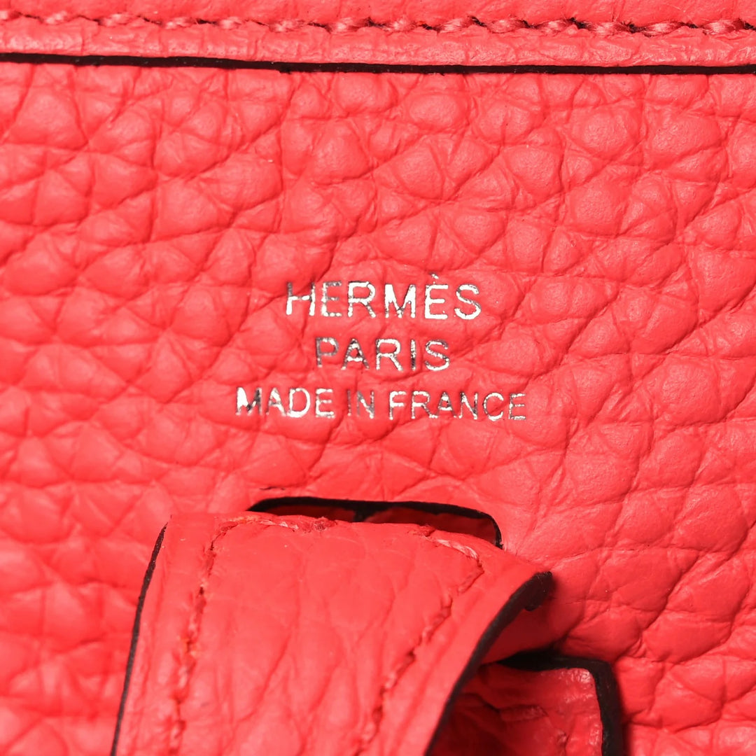 HERMÈS MINI EVELYNE CLÉMENCE LEATHER CROSSBODY BAG IN ROUGE PIVOINE