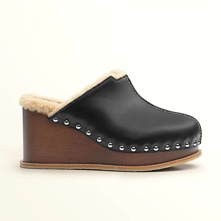 HERMÈS EARTH STUDDED SHEARLING WEDGE HEEL MULES