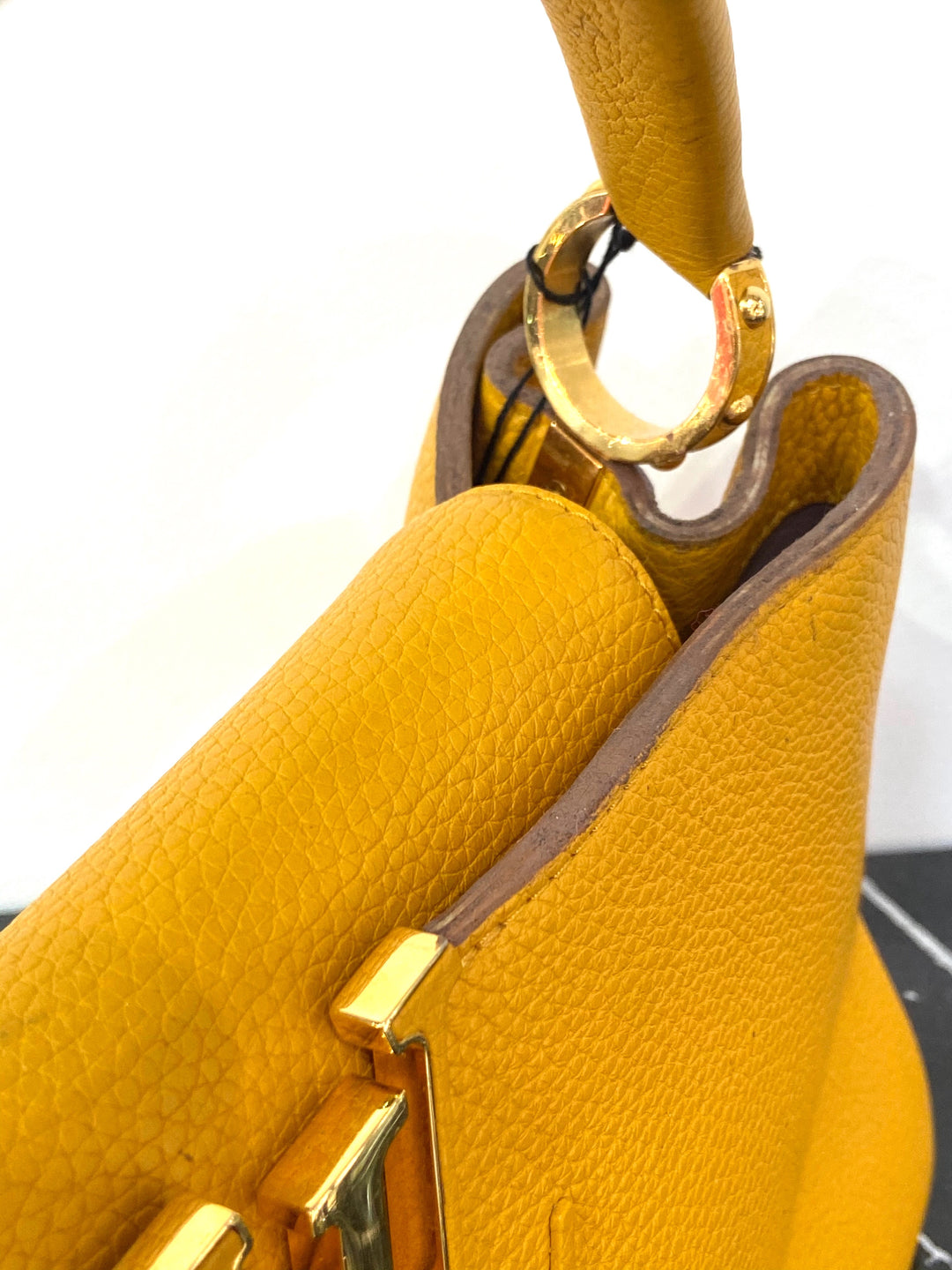 LOUIS VUITTON TAURILLON CAPUCINES MM HANDBAG TOURENESOL