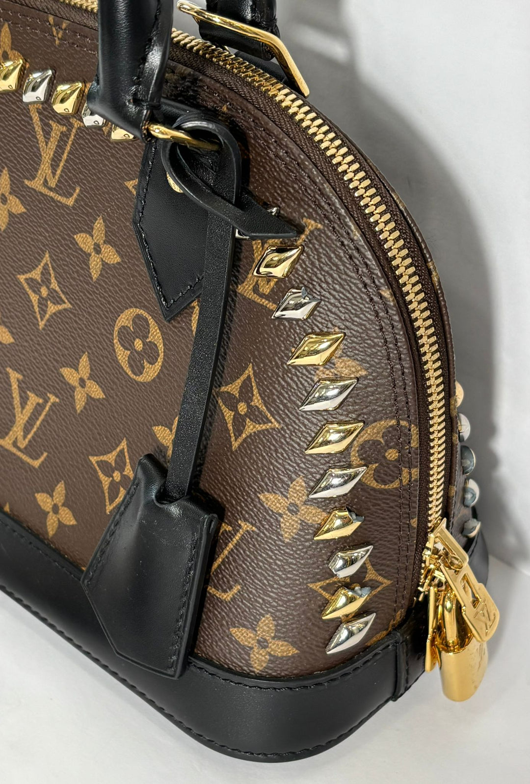 LOUIS VUITTON MONOGRAM MACASSAR STUDDED ALMA BB BAG