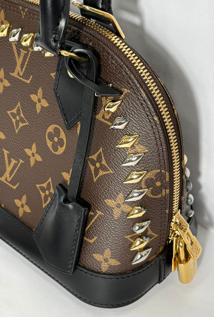 LOUIS VUITTON MONOGRAM MACASSAR STUDDED ALMA BB BAG