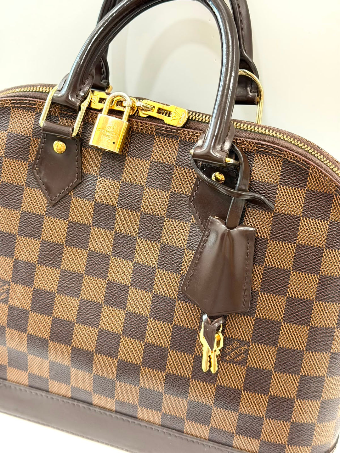 LOUIS VUITTON DAMIER EBENE ALMA PM HANDBAG