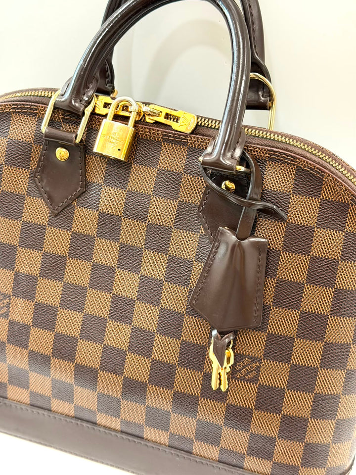 LOUIS VUITTON DAMIER EBENE ALMA PM HANDBAG