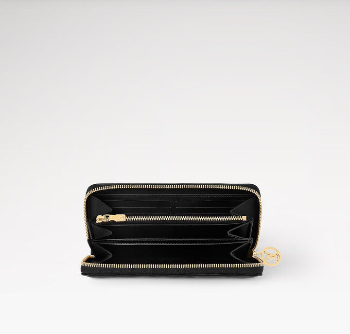 LOUIS VUITTON LAMBSKIN EMBOSSED MONOGRAM COUSSIN ZIPPY WALLET