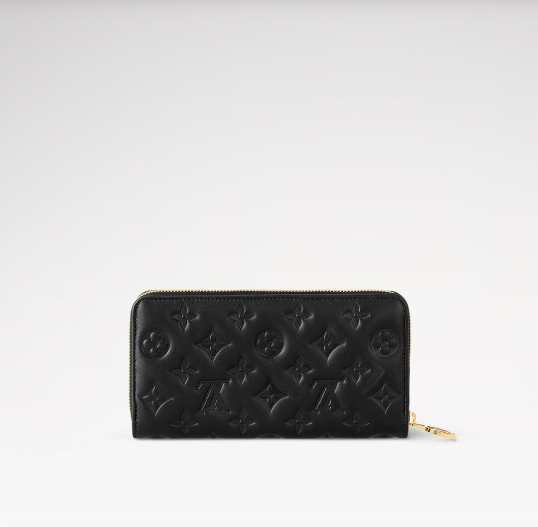 LOUIS VUITTON LAMBSKIN EMBOSSED MONOGRAM COUSSIN ZIPPY WALLET