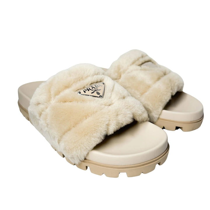 PRADA TRIANGLE LOGO SHEARLING MULES