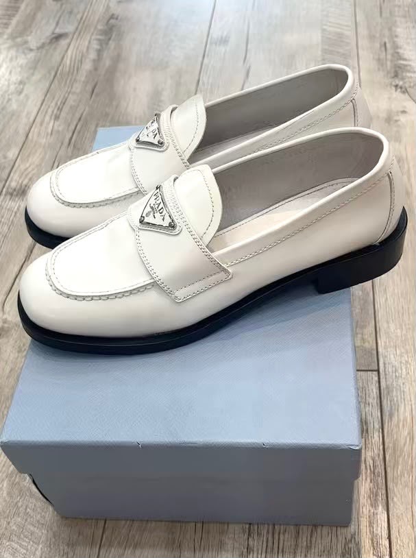 PRADA TRIANGLE LOGO PENNY SHINY BRUSHED CALFSKIN LEATHER LOAFERS