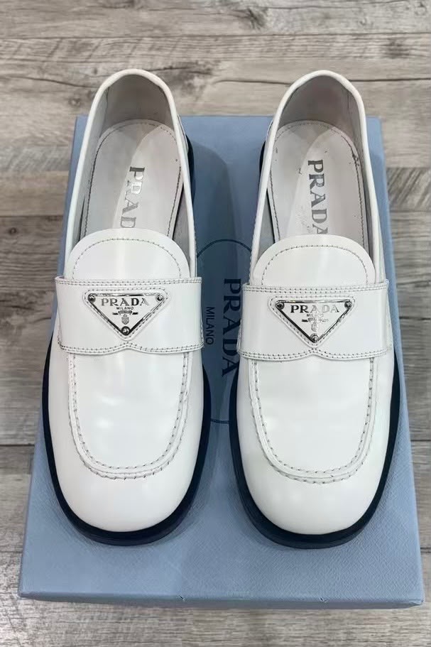 PRADA TRIANGLE LOGO PENNY SHINY BRUSHED CALFSKIN LEATHER LOAFERS