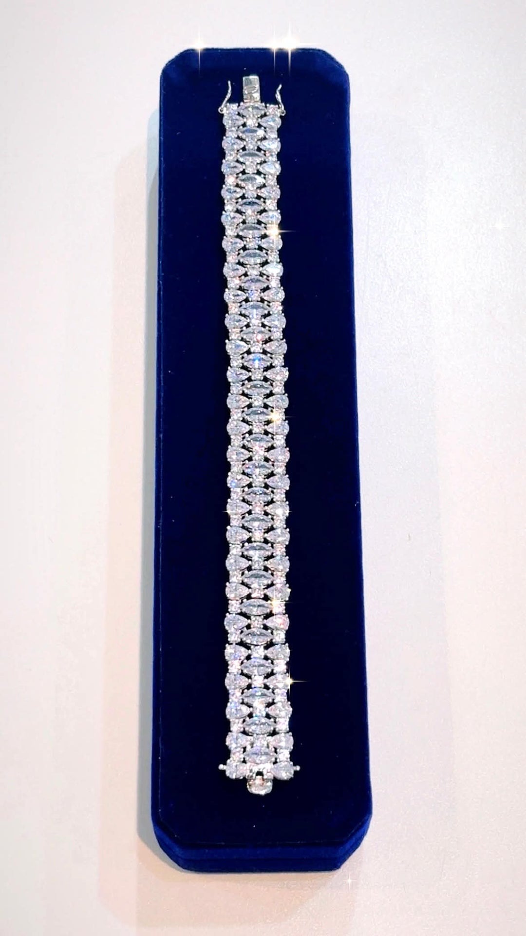 STERLING SILVER SWAROVSKI® CRYSTAL TRIPLE ROW TENNIS BRACELET