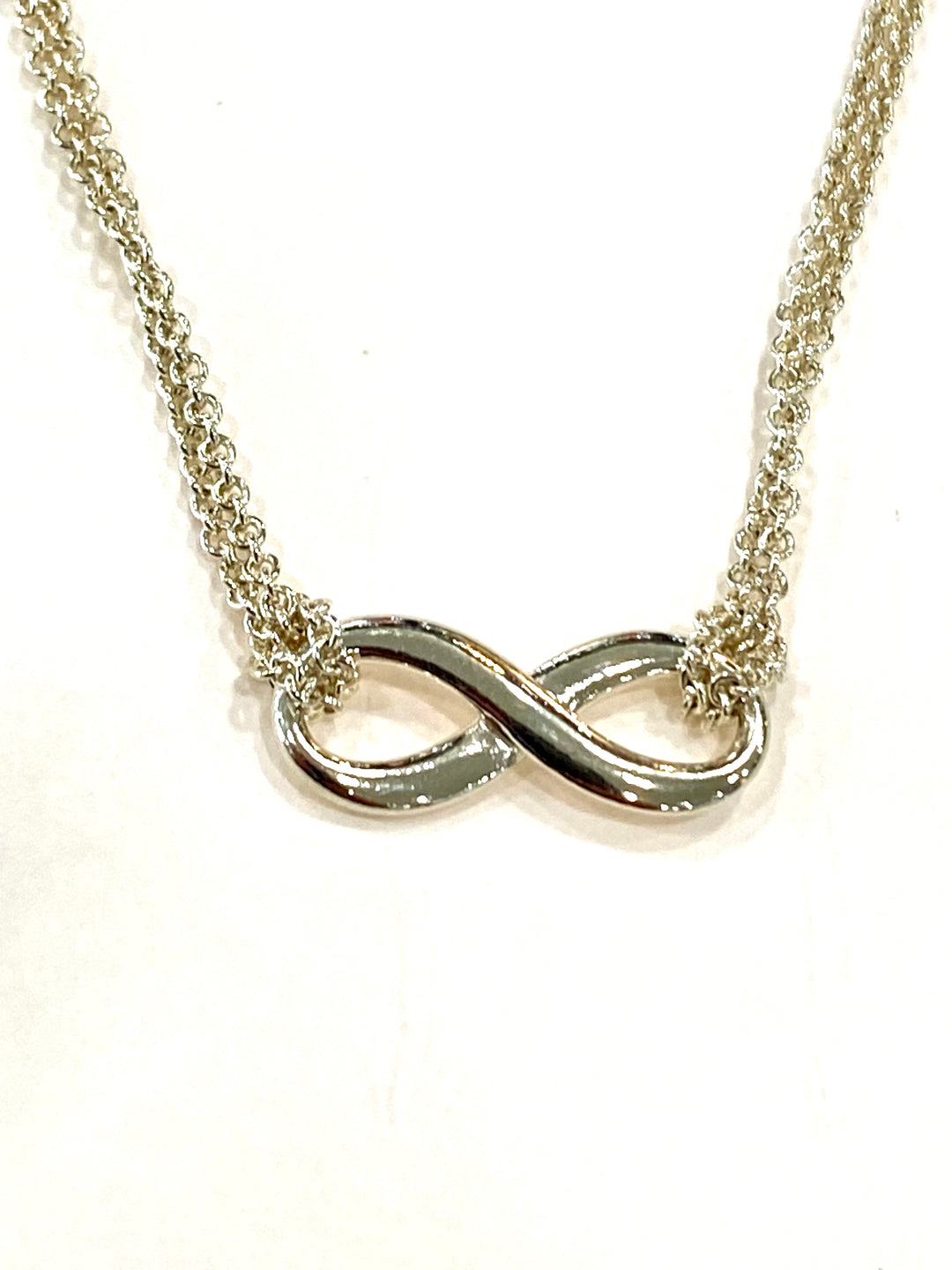 TIFFANY &amp; CO. STERLING SILVER INFINITY PENDANT NECKLACE
